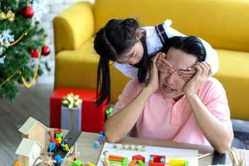 Parent and little child having fun playing educational toys,Family concept.