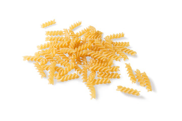 Pasta fusilli uncooked isolated on white background. Angle view.