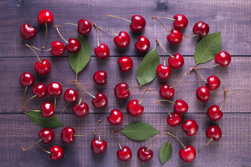 Fresh cherries on a wooden background. Top view