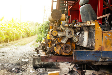 old rusted engine rear end of excavator or backhoe small in the garage repair.