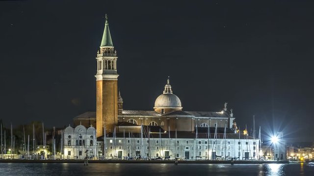 Church of San Giorgio Maggiore Venice night timelapse, Italy. Boats in venice sea at night traffic.