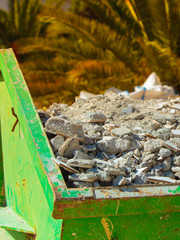 Metal container with construction waste rubble