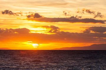 Sunrise or sunset over sea surface