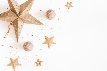 Christmas composition. Christmas golden decorations on white background. Flat lay, top view, copy...