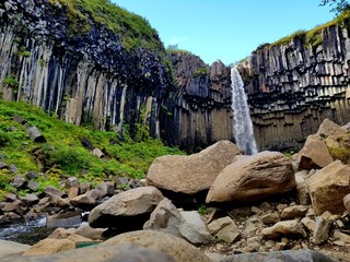 Wonderful and high Svartifoss waterfall with black basalt columns on South Iceland, summer time