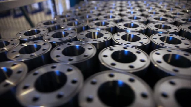 Machine parts background. Ready metal billets in warehouse. Metal parts ready