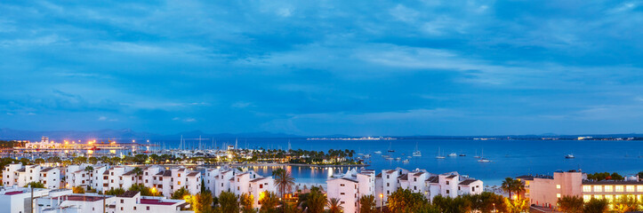 Obraz premium Panoramic view of Port de Alcudia at sunrise, Mallorca, Spain.
