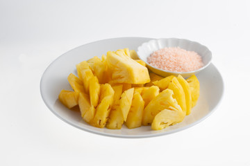 Cut pineapple with Thai spicy salt dip (sugar, salt and chili)