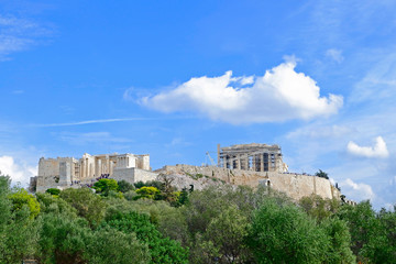 Fototapeta na wymiar Greece, Acropolis of Athens under blue cloudy sky, view from south west