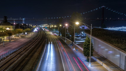 Car light trails timelapse. Night view of India Avenue in Belem zone in Lisbon Portugal