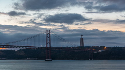 Lisbon city before sunrise with April 25 bridge night to day timelapse