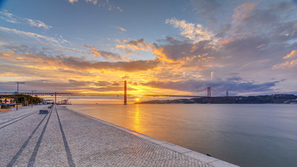 Lisbon city sunrise with April 25 bridge night to day timelapse