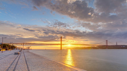 Lisbon city sunrise with April 25 bridge night to day timelapse