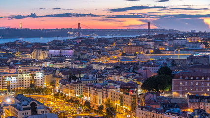 Lisbon after sunset aerial panorama view of city centre with red roofs at Autumn day to night timelapse, Portugal © HyperlapsePro