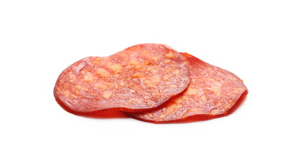 Obraz premium Spicy salami sausage slices isolated on white background