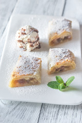 Slices of apple strudel on the white plate
