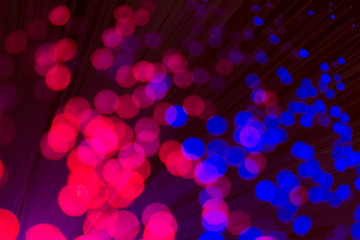 Abstract background with bright colorful dots of light, soft bokeh