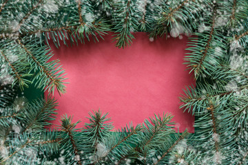 Fototapeta na wymiar Christmas red blank with evegreen branches. Merry christmas greeting card, banner, frame.
