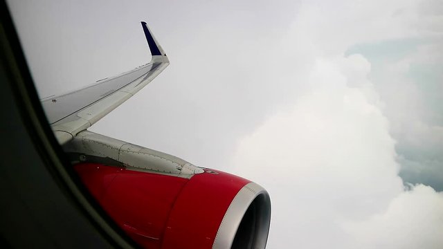 windows view of commercial airplane out of turbulence