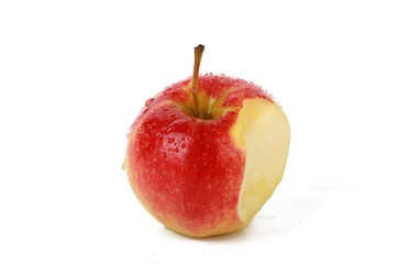 Fresh red natural apple is eaten -  Fresh organic fruit isolted on white