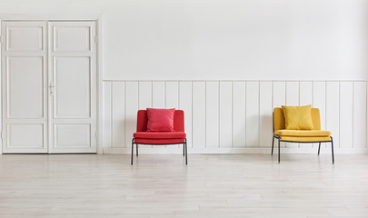 Red and yellow chair, white wall and classic door.Modern room.