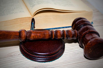 wooden gavel and books on the table, justice concept.