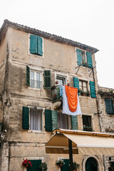 Clothes dry on the facade of an apartment building in Kotor in Montenegro. The characteristic...