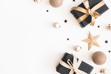Christmas composition. Gifts, black and golden decorations on white background. Christmas, winter, new year concept. Flat lay, top view, copy space
