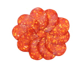 Spicy salami sausage slices isolated on white background, top view