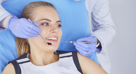 beautiful girl in the dental chair on the examination at the dentist