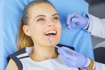 Fototapeta premium beautiful girl in the dental chair on the examination at the dentist