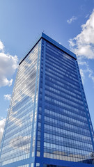 Fototapeta na wymiar A modern office building with clear blue sky.