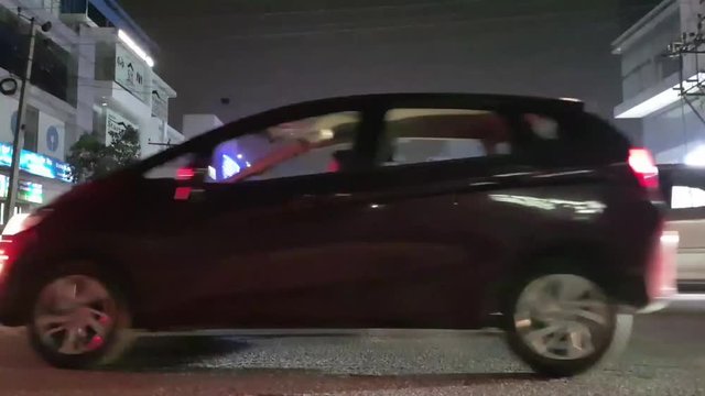 Time lapse of the traffic in the busy T intersection in HSR layout, Bangalore, Karnataka, India during night