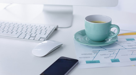 A cup of coffee on the office table