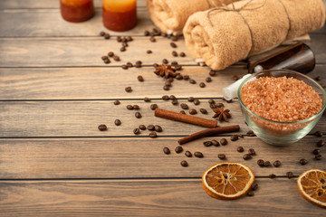 Spa still life, beauty and skin care. Coffee grains and spices with massage oil and towels, with space for designer