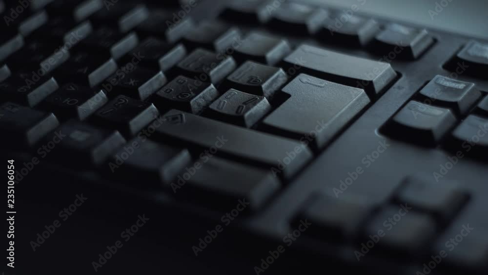 Poster close-up man presses keyboard key. man presses button enter computer keyboard. man's hand presses ke