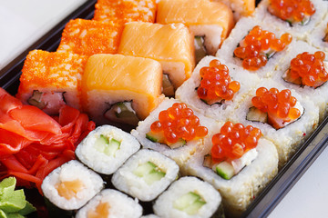 Set of Sushi Rolls with salmon, eel, tuna, avocado, cream cheese, caviar and wasabi - traditional Japanese food 