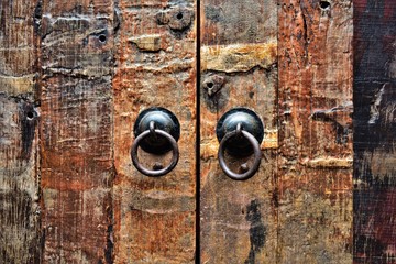 Traditional Chinese door handles on a wooden door. 