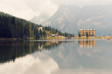 Auronzo di Cadore, Italy August 9, 2018: Misurina Mountain Lake. Beautiful tourist place with houses and cafes.