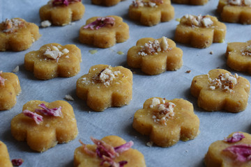 Chickpea cookies pastries with almonds and tea rose petals. Traditional Eastern sweets. Gluten free. Grain free. Paleo diet. Healthy food.