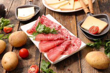 salami with potato and raclette cheese