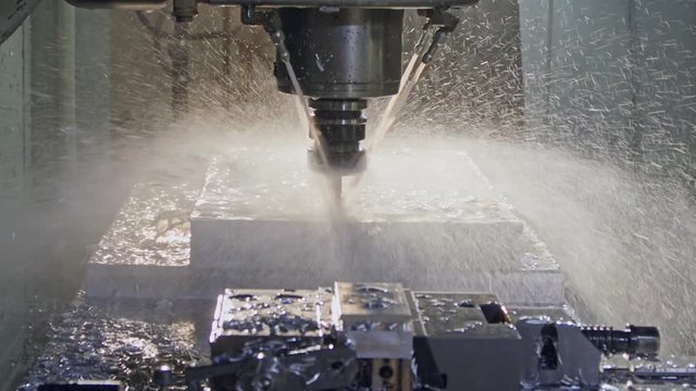 Slow motion of CNC mill manufacturing an advanced metal part