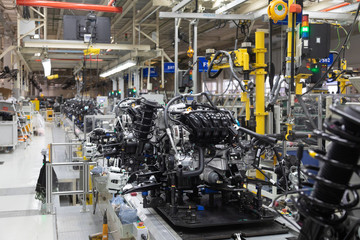 Assembly of motor vehicle. Robotic equipment makes Assembly of car. Modern car Assembly at factory