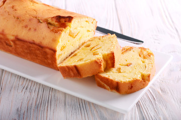 Orange pound cake, sliced on plate