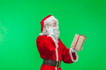 Holly jolly x mas! Funny santa in headwear, costume, black belt, white gloves brings gifts for kids, ready, prepared to celebrate, sale promotion, winter december, tallking on telephone. chromakey