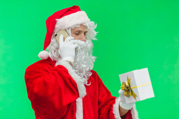 Close-up of Santa speaking on the phone. chromakey
