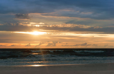 beautiful sunrise and waves on the sea