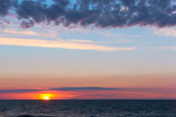 beautiful sunrise and waves on the sea