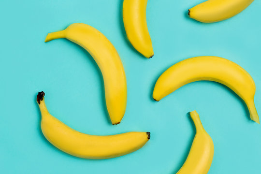 Flat lay of bananas on blue background
