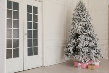 Christmas tree in the white room gifts new year